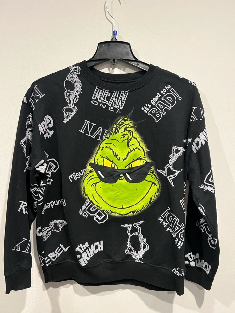 The Grinch Black Crewneck Sweatshirt with Neon Green Graphic.